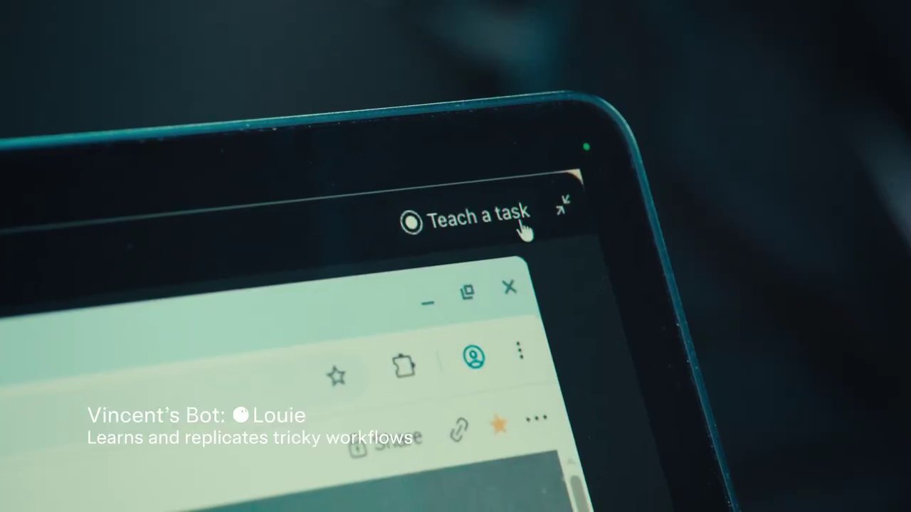 Close-up of a laptop screen with the cursor on a Teach a task button above a browser window